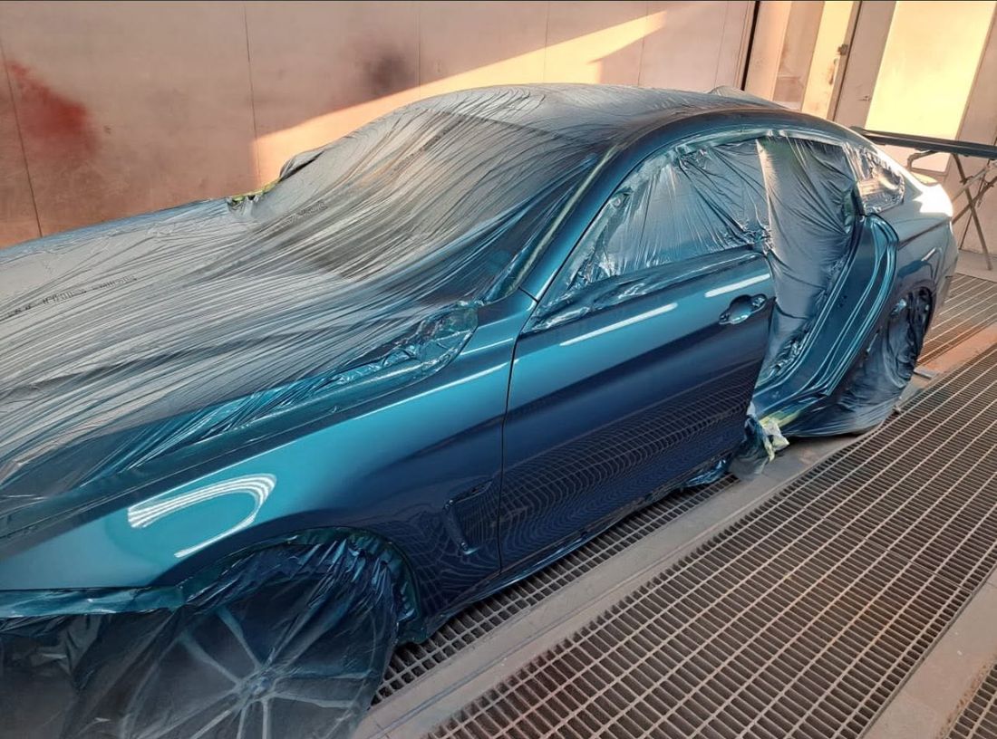 A BMW being resprayed in the Mobile Dent Pro spray booth